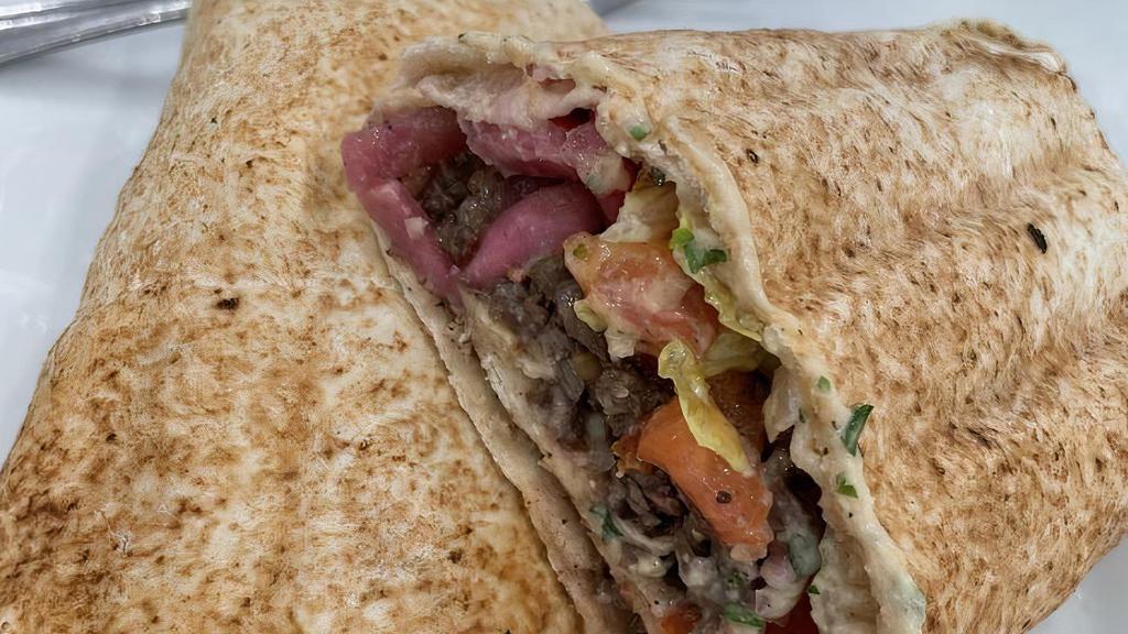 Shawarma Beef Wrap · Tender beef, tomato, onion & tahini sauce