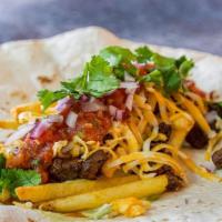 Burger Fry Burrito · ground beef, onions, shredded cheese, lettuce, tomato, french fries, ketchup, mustard and ho...