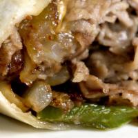 Philly Cheesesteak Burrito · Thinly sliced steak, onions, peppers, mushrooms, provolone, cheddar and Monterey jack cheese...