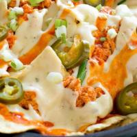 Loaded Buffalo Chicken Nachos · Nacho chips, ranch drizzle, buffalo sauce, blue cheese crumbles, scallions, jalapenos and ch...