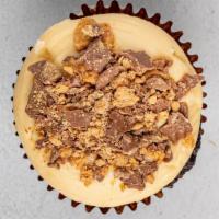Peanut Butter Cup · Six or 12 chocolate cupcakes, peanut butter cream cheese frosting, topped with crumbled Rees...