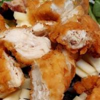 Crispy Chicken Salad · crispy chicken on a bed of medley of organic spring mix and iceberg lettuce topped with chop...