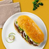 Illy Philly Cheesesteak · Thinly cut steak, melted cheese, onions, and green bell peppers.
