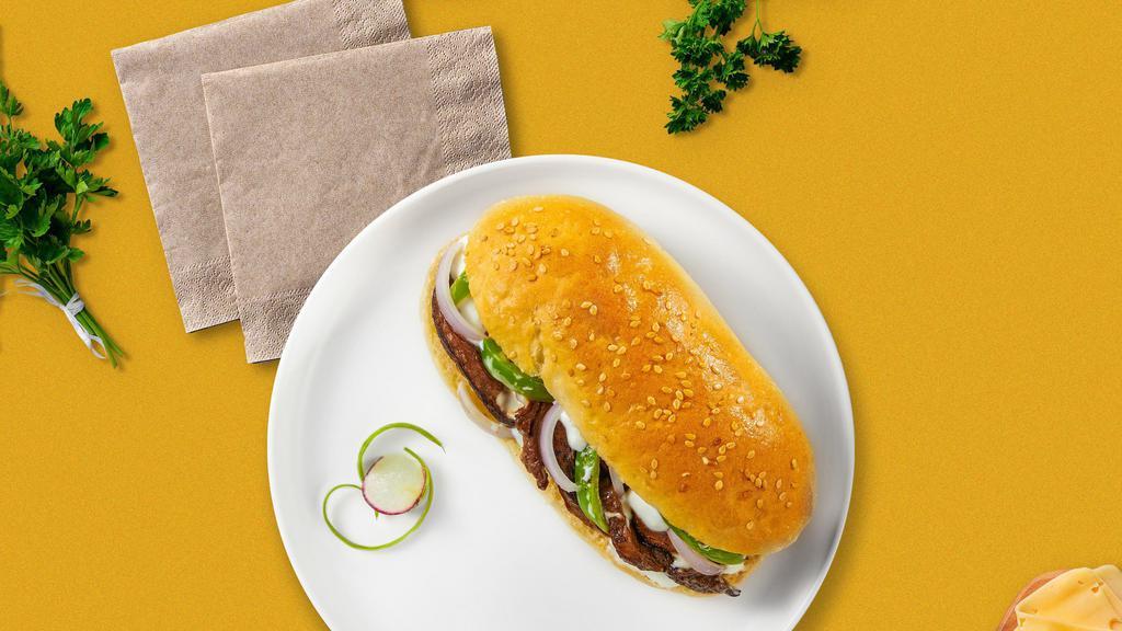 Illy Philly Cheesesteak · Thinly cut steak, melted cheese, onions, and green bell peppers.