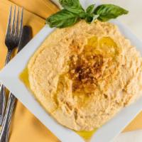 Hummus · Delicious combination of garbanzo bean mixed with tahini, garlic, lemon juice with olive oil.