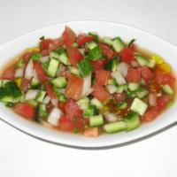 Salad Shirazi! · Mixed diced tomatoes, cucumbers, onions, herbs and olive oil dressing.