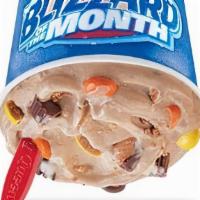 Reese'S Extreme Blizzard® Treat · Reese's Peanut Butter Cups, Reese's Pieces, peanut butter topping and chocolate topping.