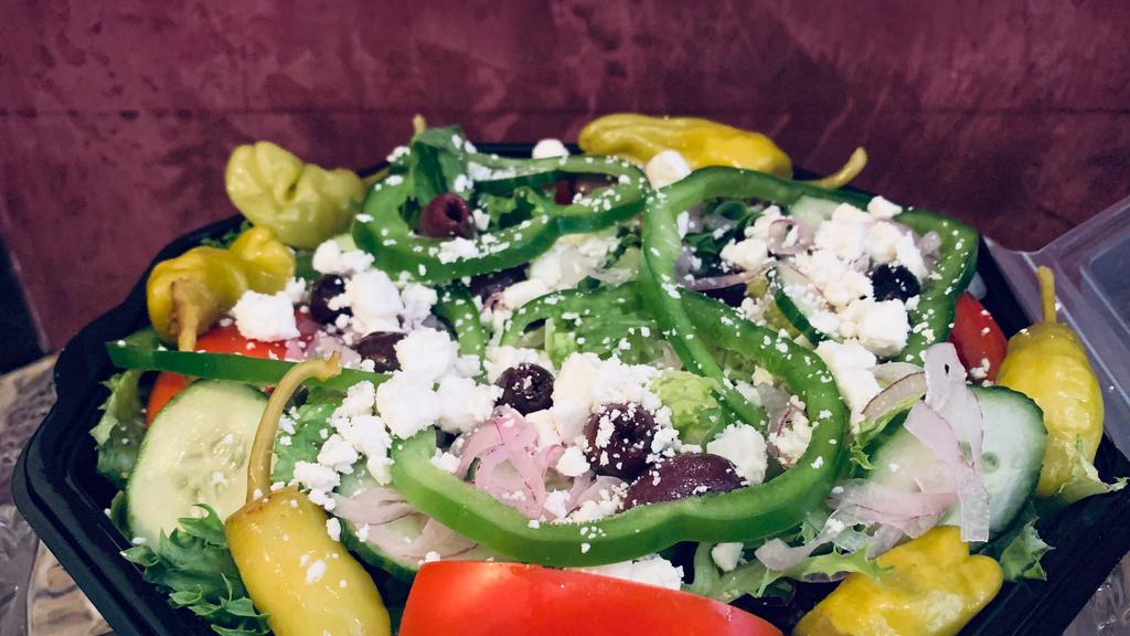 Greek Salad · Mixed greens, bell pepper, red onion, Roma tomato, sliced cucumber, kalamata olive, feta cheese, pepperoncini,  red wine vinaigrette