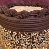 German Chocolate Cake · Chocolate cake filled with German chocolate filling and decorated with chocolate icing and p...