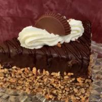 Peanut Butter Cake Wedge · Chocolate chiffon cake layers filled with a decadent peanut butter mousse, covered in chocol...