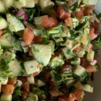 The Shlomo Salad · Tomatoes, cucumbers, parsley, cilantro, red onion, and tossed with extra virgin olive oil an...