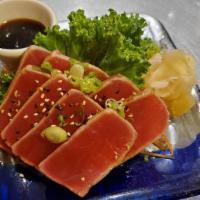 Tuna Tataki · Fresh seared tuna with Ponzu sauce dressing.

Consuming raw or undercooked meats, poultry, s...