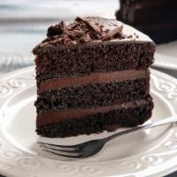 Chocolate Cake · Moist dark chocolate cake layered and topped with rich chocolate ganache frosting.