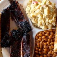 Rib Plate (3 Bones) · Three bone St. Louis style ribs with two side items and garlic toast.