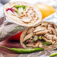 Chicken Shawarma Wrap · Made with strips of spit-roasted chicken, lettuce, tomato, pickles, sumac onions, purple cab...