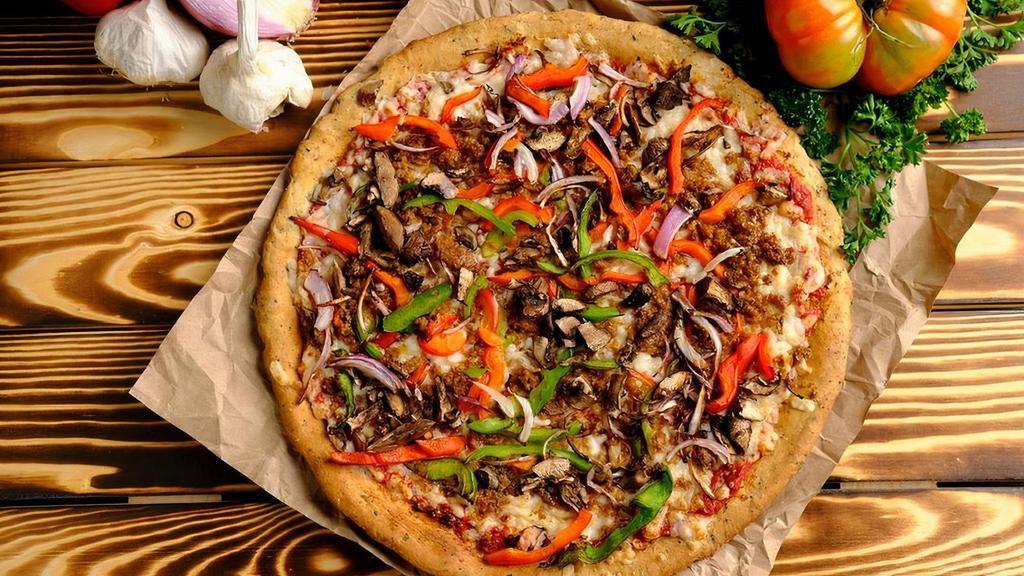 Philly Pizza · Spelt Crust, Roasted Basil Pizza Sauce, Vegan Mozzarella Cheese, Mild Beyond Sausage, Red Onions, Bell Peppers & Portabella Mushrooms.