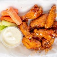 10 Boneless Wings · 10 boneless wings (approx. 8 pieces) tossed in your favorite sauce.  Served with celery, car...