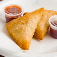 Chicken Samosa (2 Pcs) · A traditional indian style, ground chicken with spices