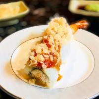 Volcano Roll · Tempura shrimp and crab salad inside
Topped with spicy mayo, sriracha, teriyaki sauce, and t...