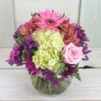 Happiness · A bubble bowl full of flowers in subtle shades. Pink gerberas and roses, carnations and dain...