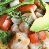 Tostada De Ceviche Mixto · Shrimp, Octupus, imitation crab meat, tomatoes, and avocado. All cooked in fresh lime