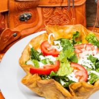Taco Salad · Hard-shell flour tortilla, rice, beans, romaine lettuce, tomatoes, lettuce, onions, cheese a...