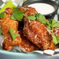 Spicy Italian Wings · The Best Spicy Wings in the Galaxy!  Italian flavored with parmesan and spices served with D...