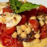 Polipo Alla Griglia · Mediterranean grilled octopus, chickpea puree, and tomato-basil salad.