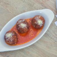 Polpettine · Ricotta, veal, and spinach meatballs in arrabbiata sauce.