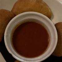 Panzerotti · Stuffed pizza dough with mozzarella. Served with marinara sauce.