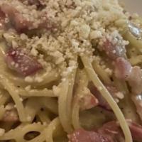 Carbonara  · spaghetti pasta , pecorino and pancetta , black pepper egg yolk