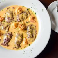 Mezzaluna Di Granchio · Filled with crab meat, baby shrimp in a creamy lobster sauce.