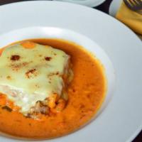 Lasagna Di Carne · Ground beef, mozzarella and Parmesan cheese in pink sauce.