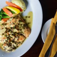 Chicken Piccata · Chicken breast sauteed with capes, in white wine lemon sauce.
