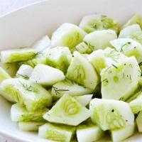 Cucumber Salad · Cucumbers, tomatoes, onion, cilantro lemon, lime, and salt.