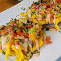 Tostones Con Pollo · Fried green plantains layered with shredded chicken, vegetables, melted cheese, pink and cil...
