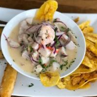 Ceviche Mixto · Fresh fish and shrimp marinated in lime juice with limo peppers, red onion and cilantro serv...