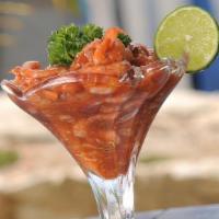 Ceviche Clasico · Fresh fish marinated in lime juice with limo pepper, red onions and cilantro served with yuc...