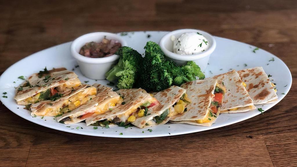 Ouesadilla De Vegetales · Fresh vegetables, sautéed onions, peppers, mushrooms, tomatoes, broccoli, mixed cheese in a grilled flour tortilla. Served with sour cream and pico de gallo. Add 2 oz. fresh guacamole.