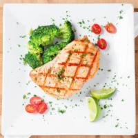 Salmon · Grilled fresh salmon from chile, served with mashed potatoes, broccoli, and salad.