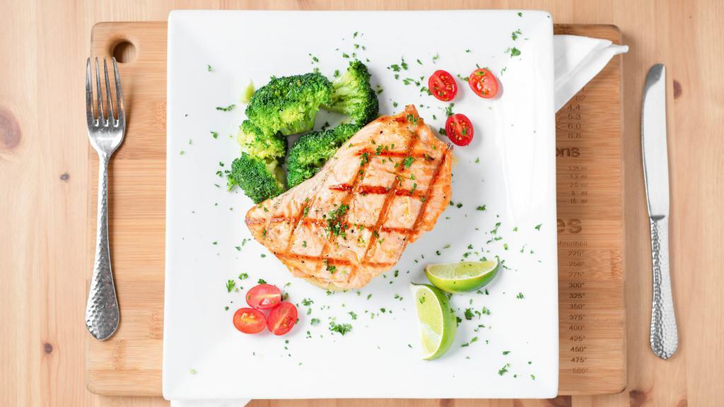 Salmon · Grilled fresh salmon from chile, served with mashed potatoes, broccoli, and salad.