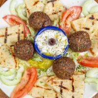 Falafel (4) · Vegetarian. Fried ground chickpeas with herbs, served with tzatziki and pita bread.