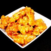 Orange Chicken · Crispy chicken wok-tossed in sweet home made orange sauce.