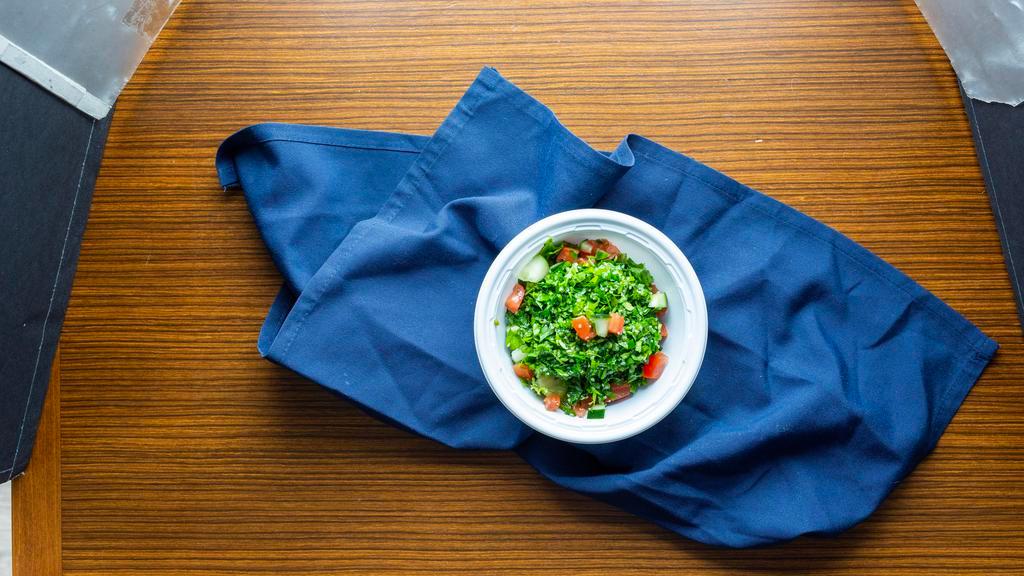 Tabouleh Salad · A mix of chopped parsley with green onions, mint, cracked wheat, tomato with olive oil and lemon juice dressing. Ask for no cracked wheat to make it Gluten Free.