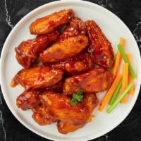 Kinda Buff Wings  · Fresh chicken wings, fried until golden brown, and tossed in buffalo sauce. Served with a si...