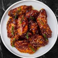 Wing Of The Orient  · Fresh chicken wings, fried until golden brown, and tossed in teriyaki sauce. Served with a s...