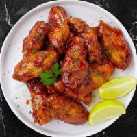 Blockbuster Bbq Wings  · Fresh chicken wings, fried until golden brown, and tossed in barbecue sauce. Served with a s...
