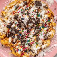 Traditional Funnel Cake · Fresh, fried funnel cake covered with powdered sugar & whipped cream