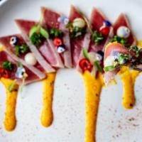 Tuna Tataki · Seared tuna, aji amarillo sauce, chirimoya, chalaquita. GF available