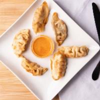 Pot Stickers (6)  · Pan-fried or steamed pork dumpling, served with Panang curry sauce.